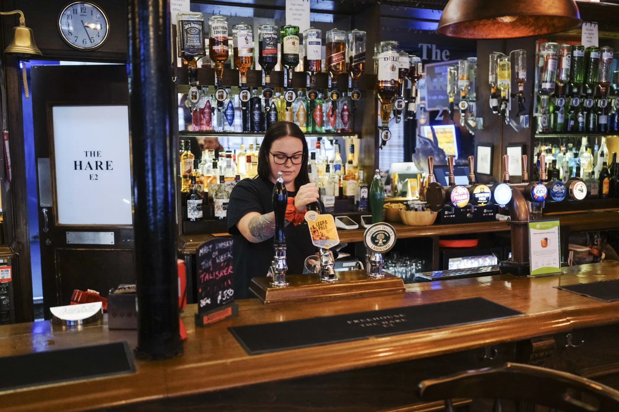 An employee pours a beer at The Hare, a pub in Tower Hamlets,&nbsp;London.
