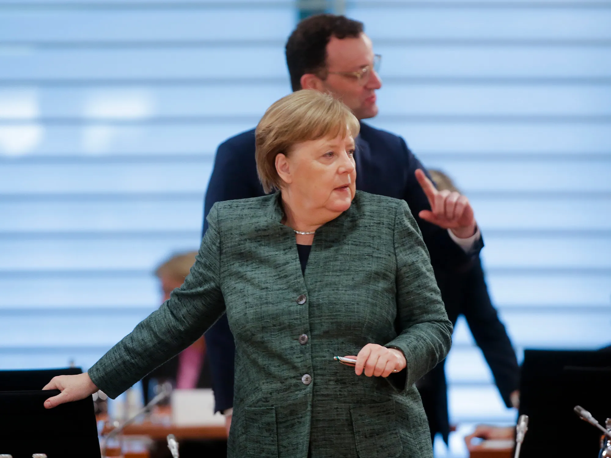 Angela Merkel and Jens Spahn arrive for a weekly cabinet meeting in Berlin, on April 8.