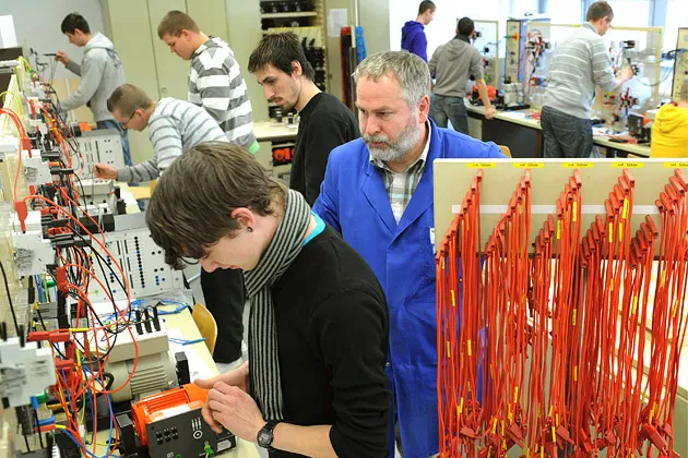 Apprentices for control engineering  pictured at education and technology center of the chamber of handicrafts in Leipzig, Germany