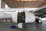 An engineer works on an aircraft engine at PT Garuda Indonesia's maintenance facility at Soekarno-Hatta International Airport in Cengkareng, near Jakarta, Indonesia.