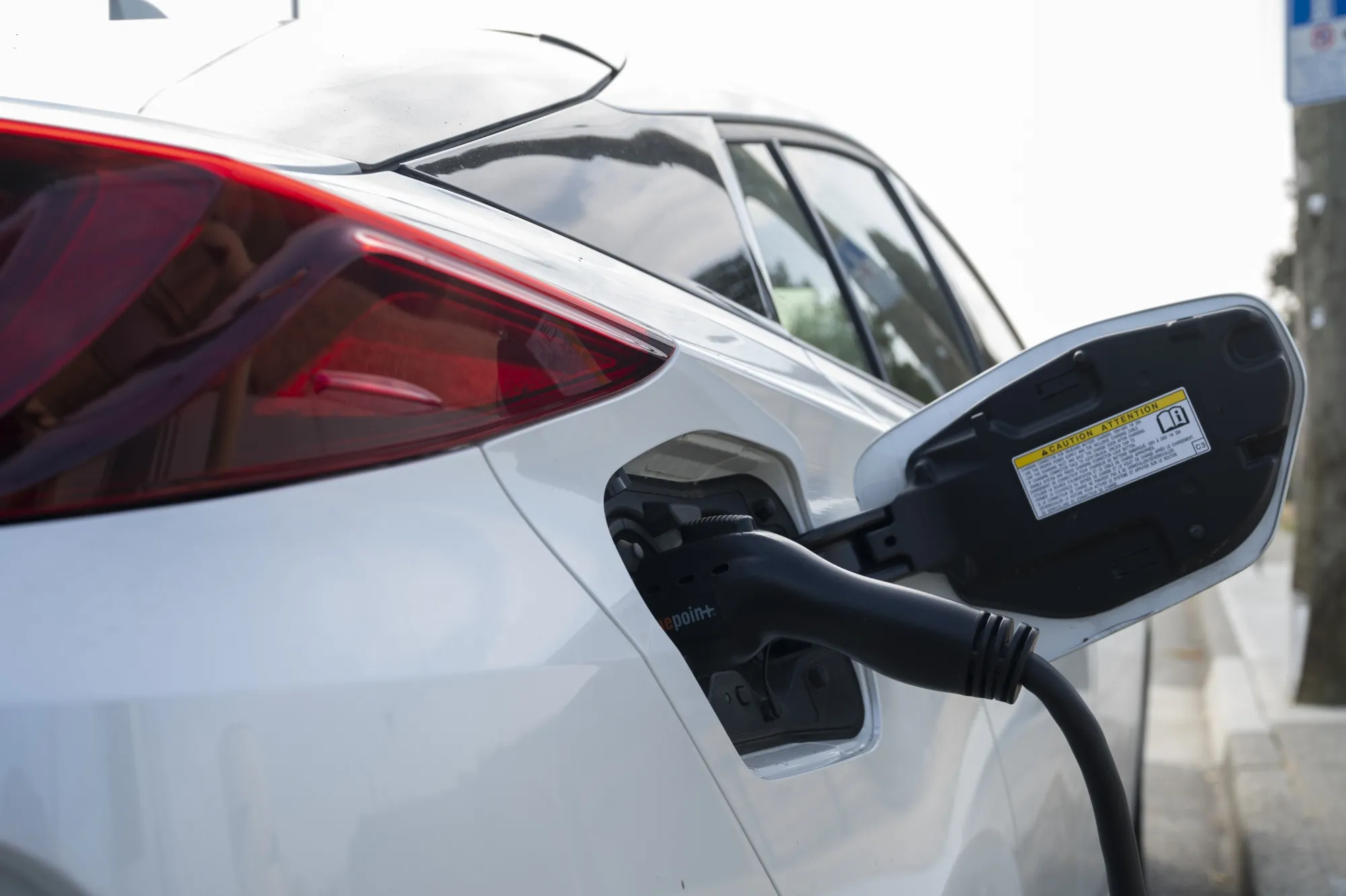 An&nbsp;electric vehicle charges at a&nbsp;station in North Vancouver, British Columbia, Canada.