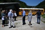 Joe Biden, center, First Lady Jill Biden, second right, and Kentucky Governor Andy Beshear, right, view flood water damage in Lost Creek, Kentucky, on Aug. 8.