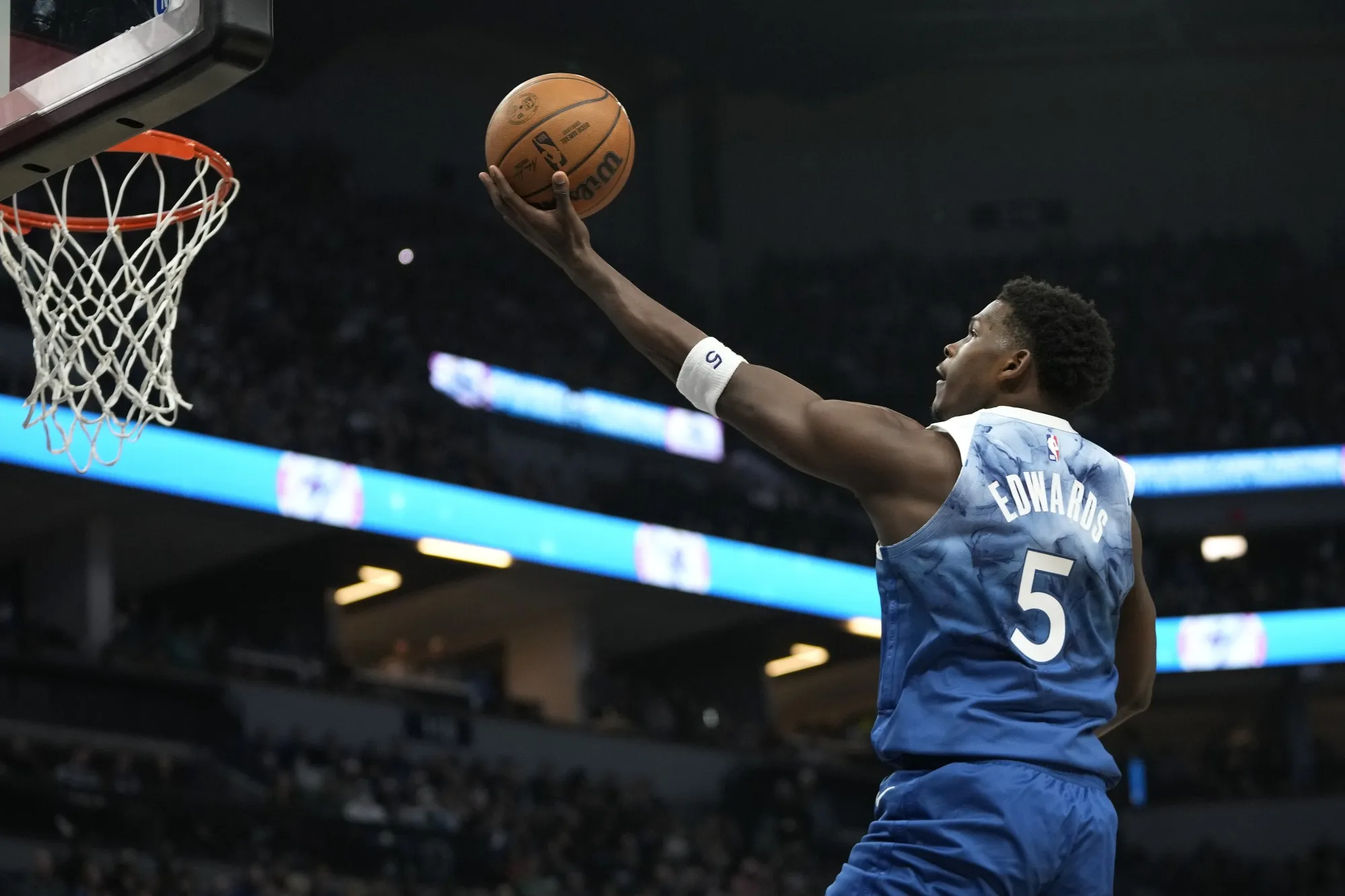 Minnesota Timberwolves guard Anthony Edwards (5) goes up to shoot during the first half of an NBA basketball game against the Los Angeles Lakers, Thursday, Dec. 21, 2023, in Minneapolis. (AP Photo/Abbie Parr)