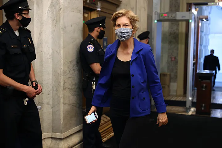 Elizabeth Warren wears a protective face mask as she arrives at the U.S. Capitol for a vote on May 18.