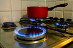 Natural gas burns on a stove top.