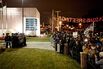 Protesters wait in front of the Ferguson Police Deparment beneath a “Seasons Greetings” sign.
