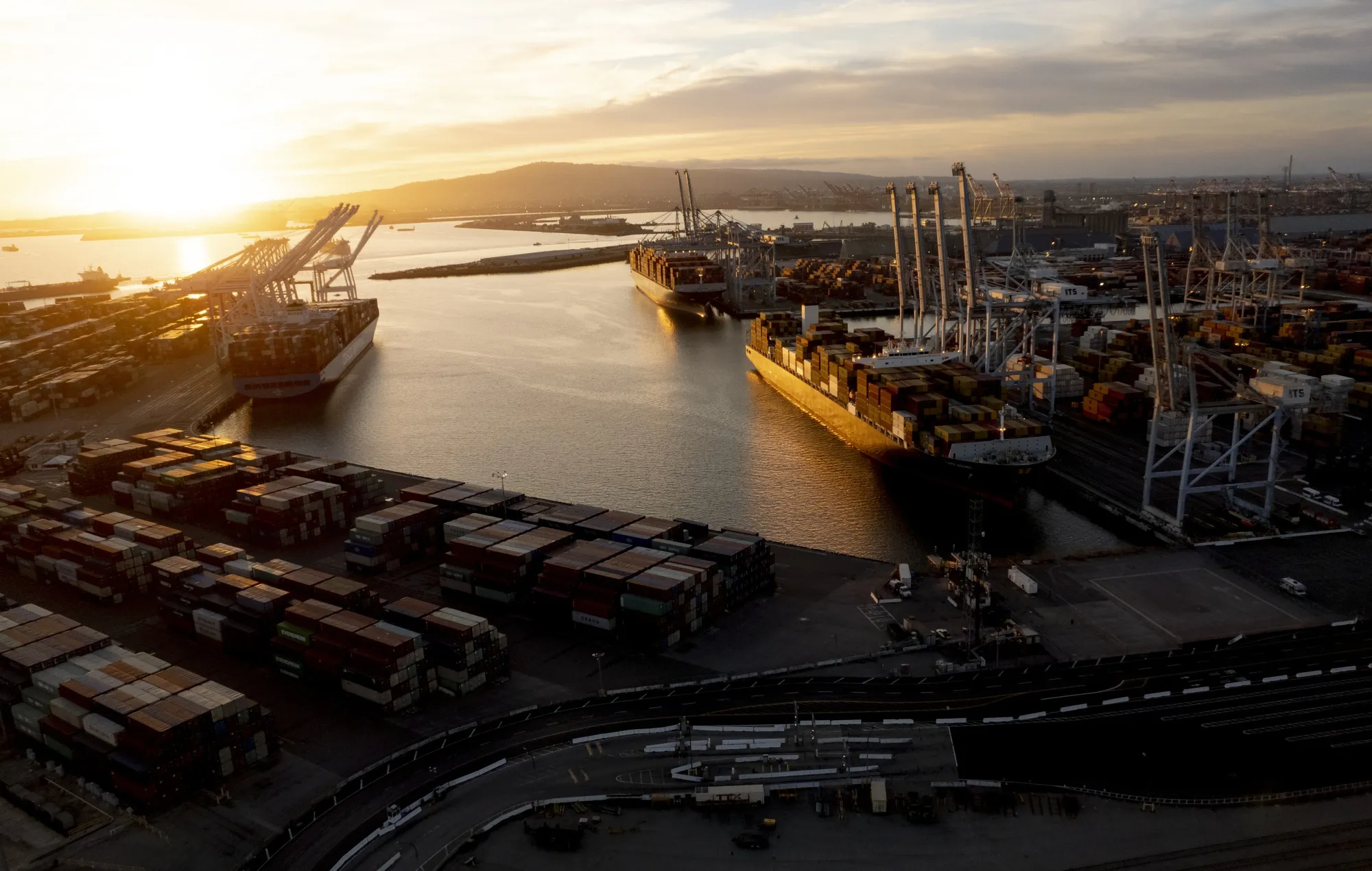 Cargo ships are unloaded at the Port of Long Beach in Long Beach, California, on Oct. 24.