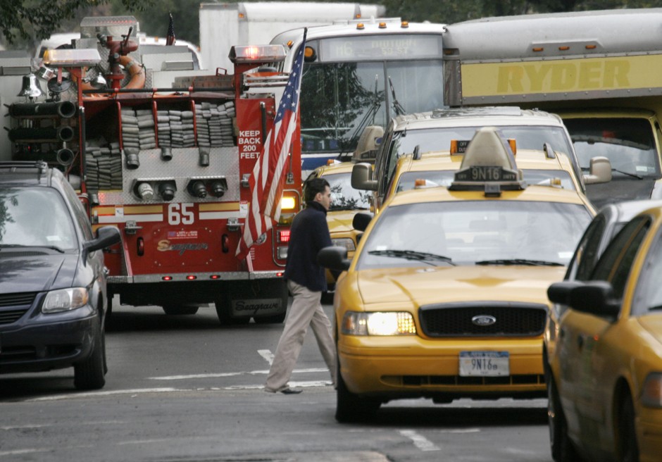 Traffic winds around a fire truck in New York.