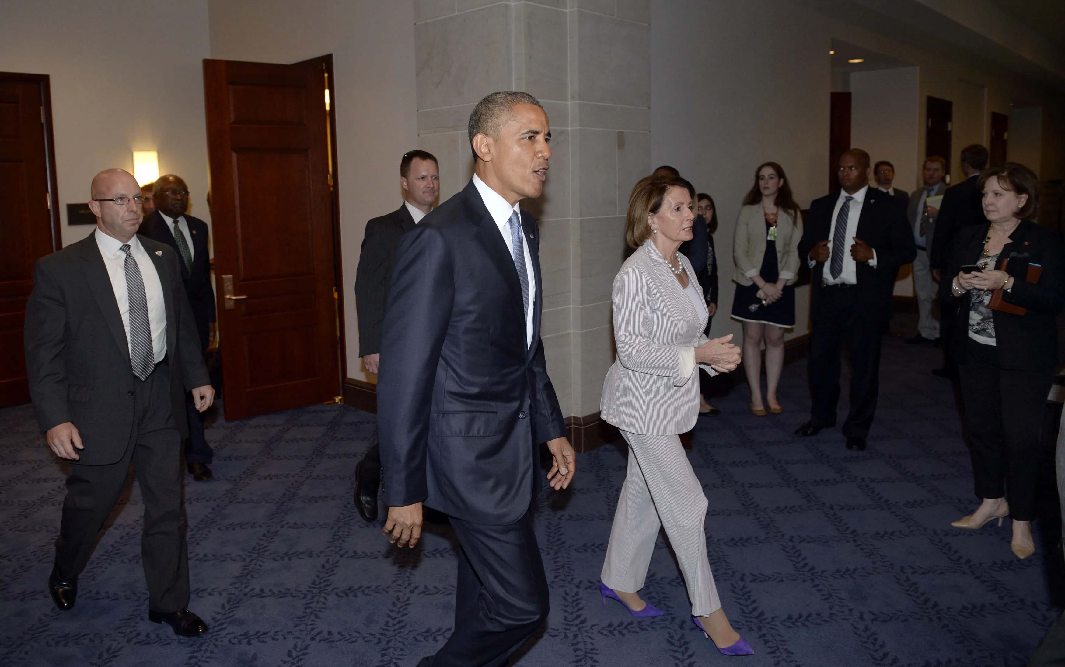President Barack Obama and House Minority Leader Nancy Pelosi leave the Gabriel Zimmerman room after a meeting with members of the House Democratic caucus to discuss his trade agenda on Capitol Hill June 12, 2015 in Washington, D.C. Photo by Olivier Douliery/SIPA
