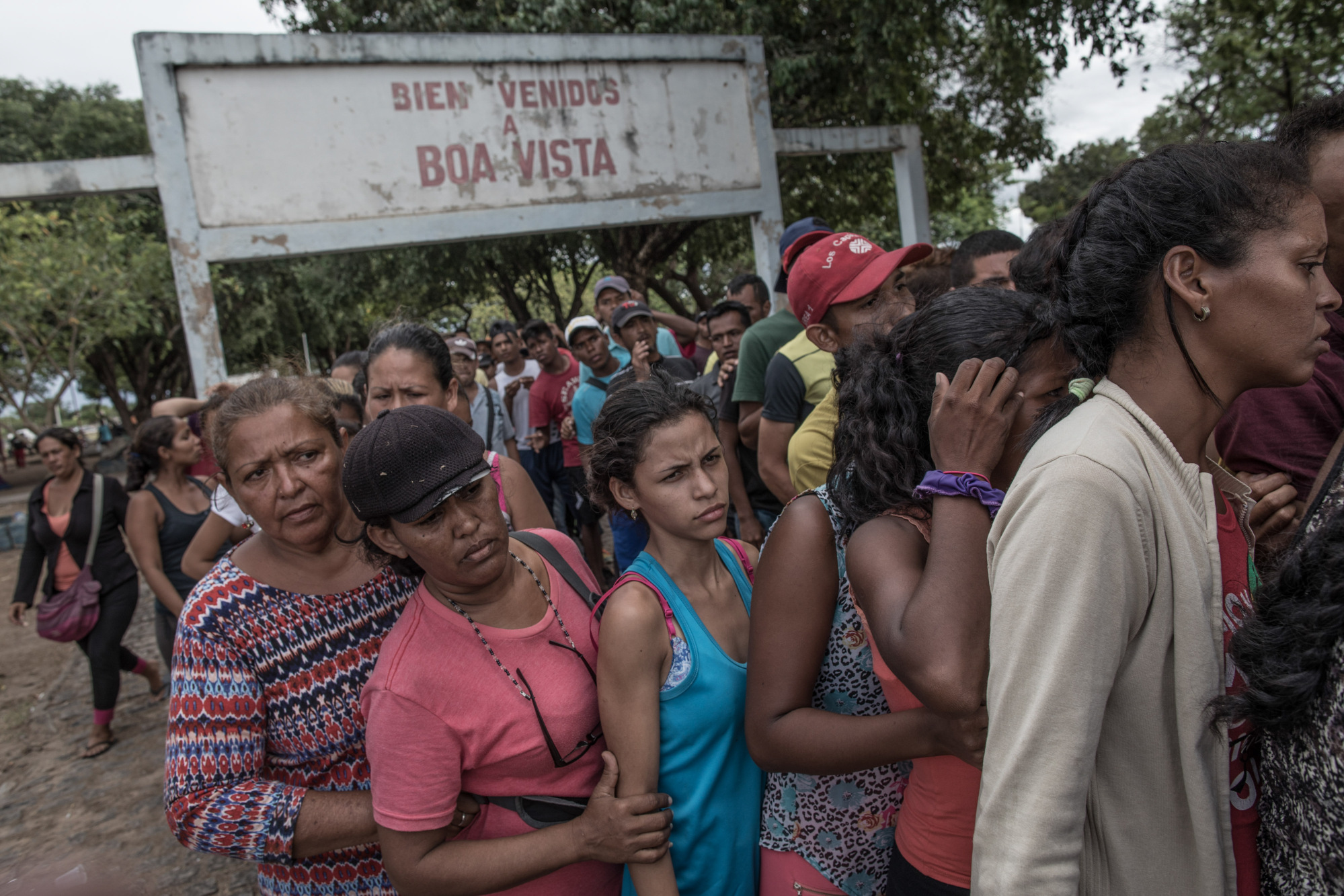 Venezuelans wait in line to receive food donations at Simon Bolivar Square in Boa Vista, Brazil.