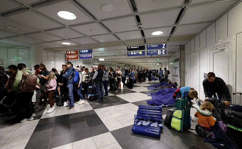 Passengers queue&nbsp;at Munich International Airport,&nbsp;early Oct. 4.