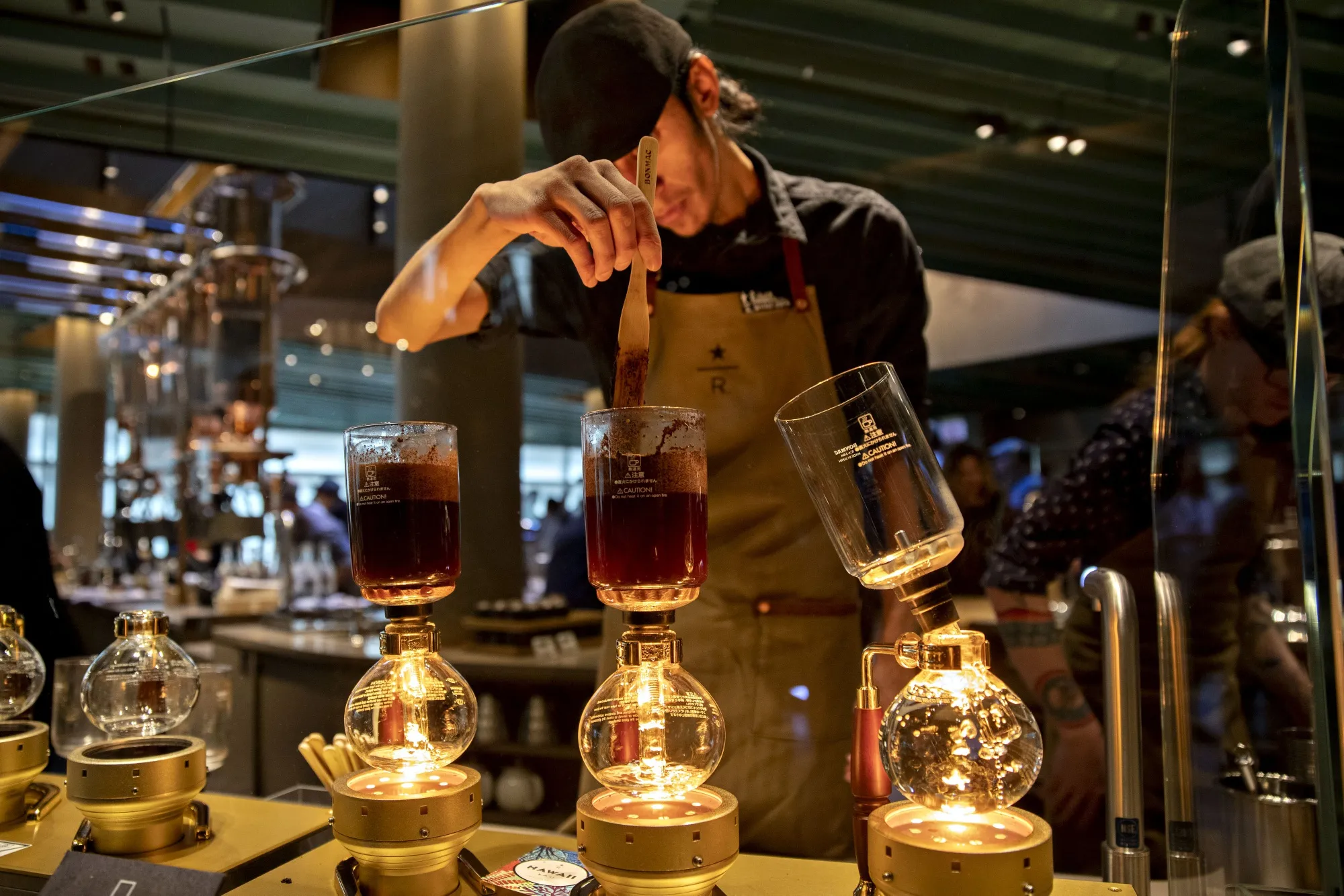 A barista prepares coffee at the Starbucks Reserve Roastery in Chicago.