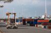 A straddle carrier vehicle stands beside shipping containers on the dockside at the Port of Le Havre in Le Havre, France, on Thursday, Sept. 6, 2018. France is benefiting from solid economic expansion in the euro zone after years of European Central Bank stimulus, and a trade dispute with the U.S. that could have led to higher tariffs seems to have subsided for now.