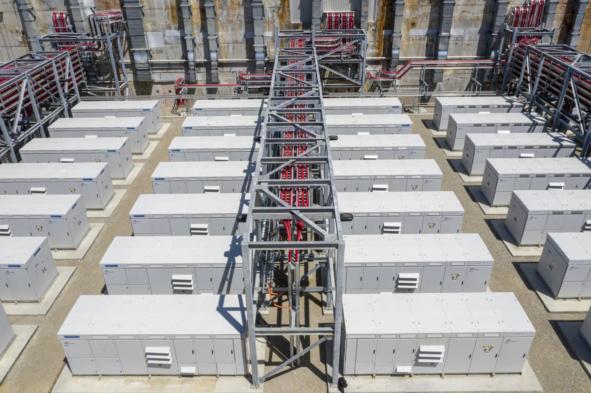Power inverters and cabling outside the battery building at Vistra’s&nbsp;Moss Landing Energy Storage Facility in Moss Landing, California.