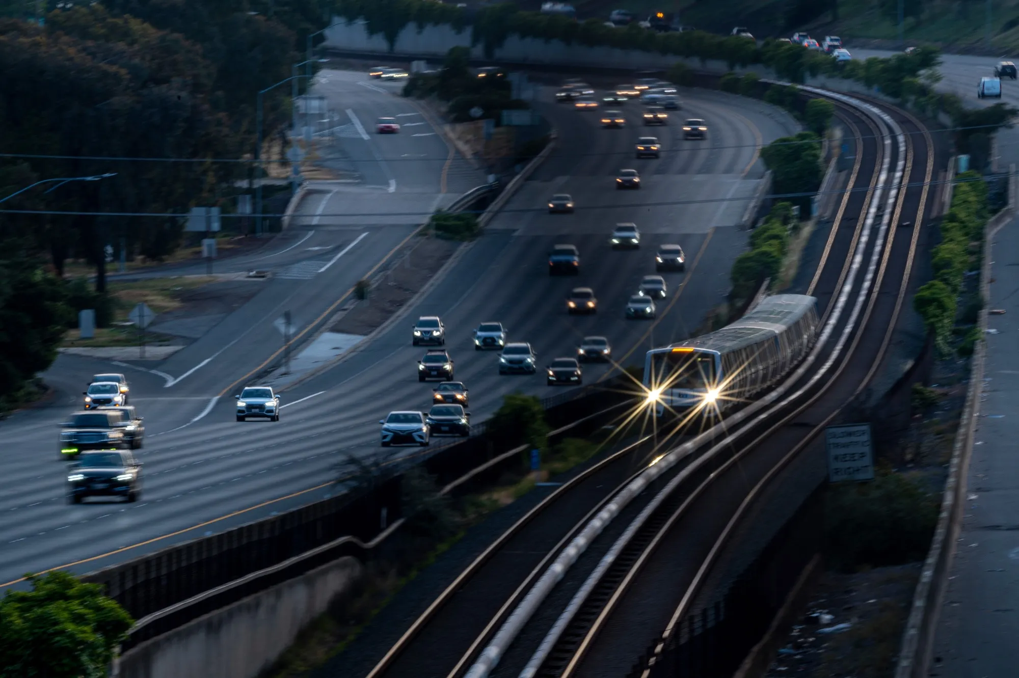 A train beside vehicles on Highway 24 in Lafayette, California, on May 25, 2023.&nbsp;