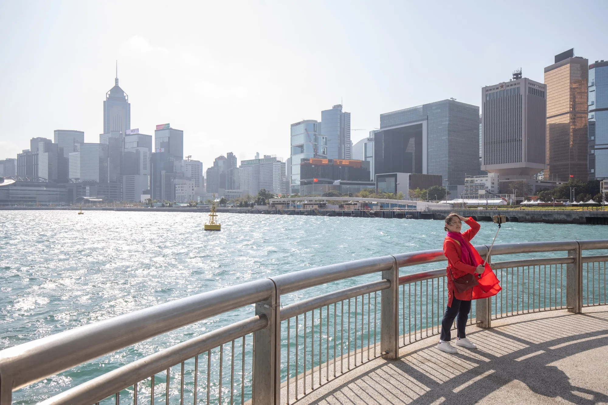 A person takes a selfie photograph in Hong Kong, China.