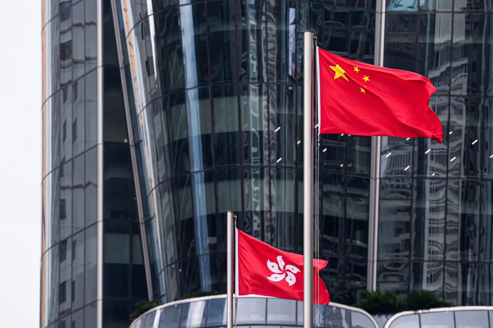 Flags over Hong Kong’s financial district.&nbsp;