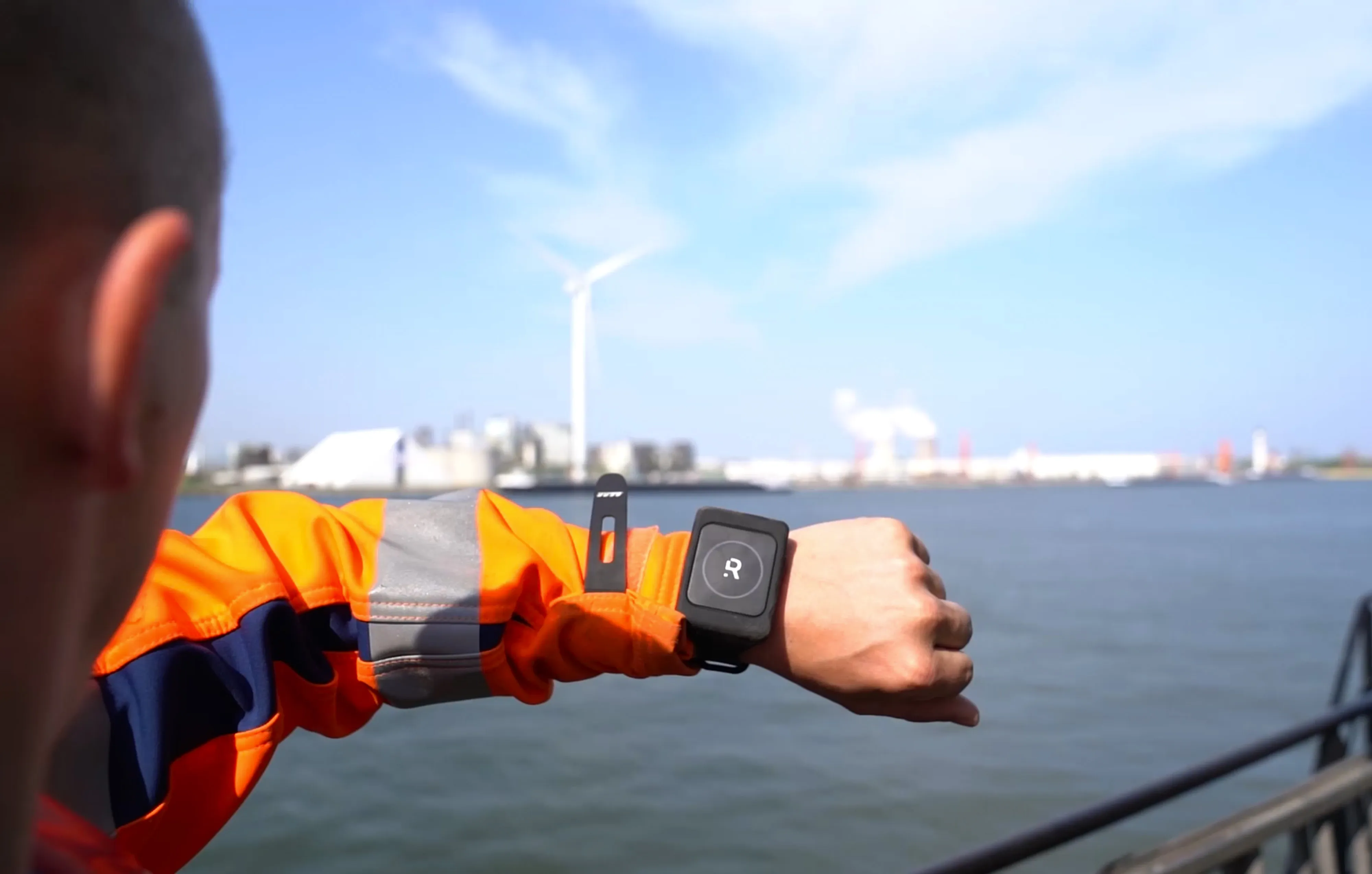 A dock worker wears a “Romware Covid Radius bracelet” at the Port of Antwerp.