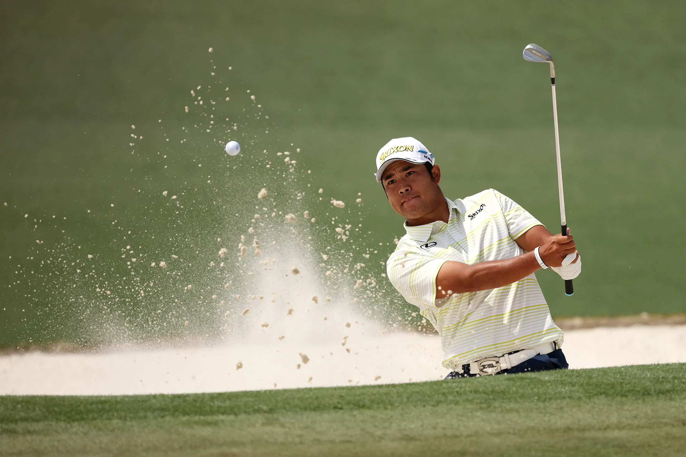 Hideki Matsuyama&nbsp;plays a shot from a bunker&nbsp;during the final round of the Masters at Augusta National Golf Club on April 11.