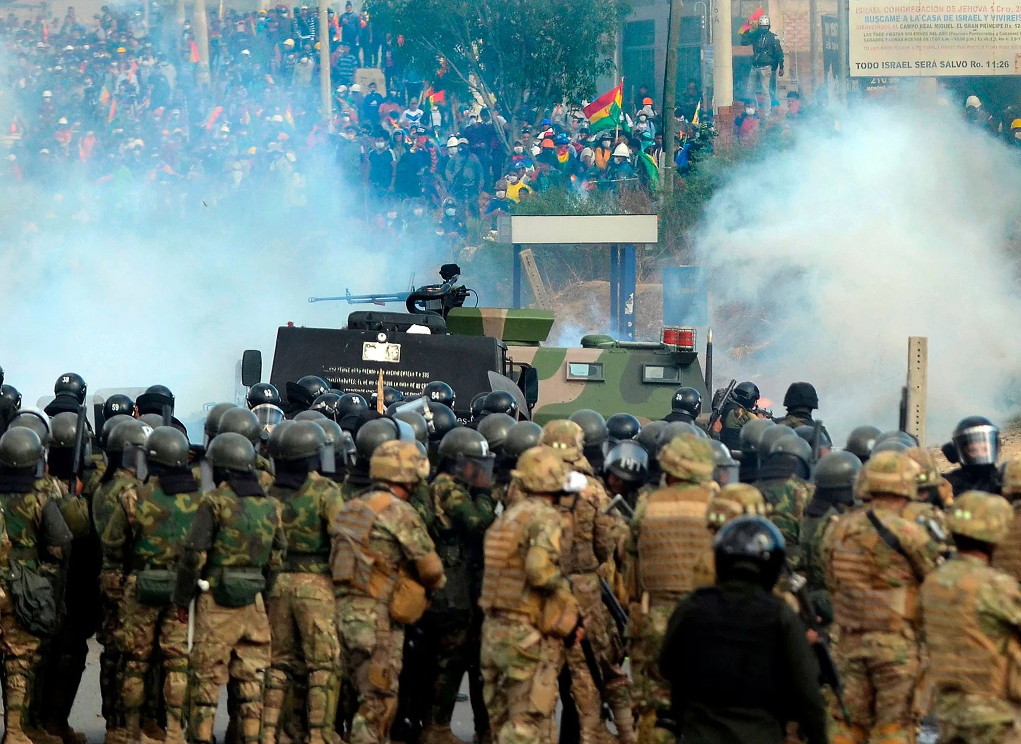 Bolivian riot police and soldiers clash with supporters of Bolivia's ex-President Evo Morales during a protest against the interim government in Sacaba, Chapare province,&nbsp;Nov. 15.&nbsp;