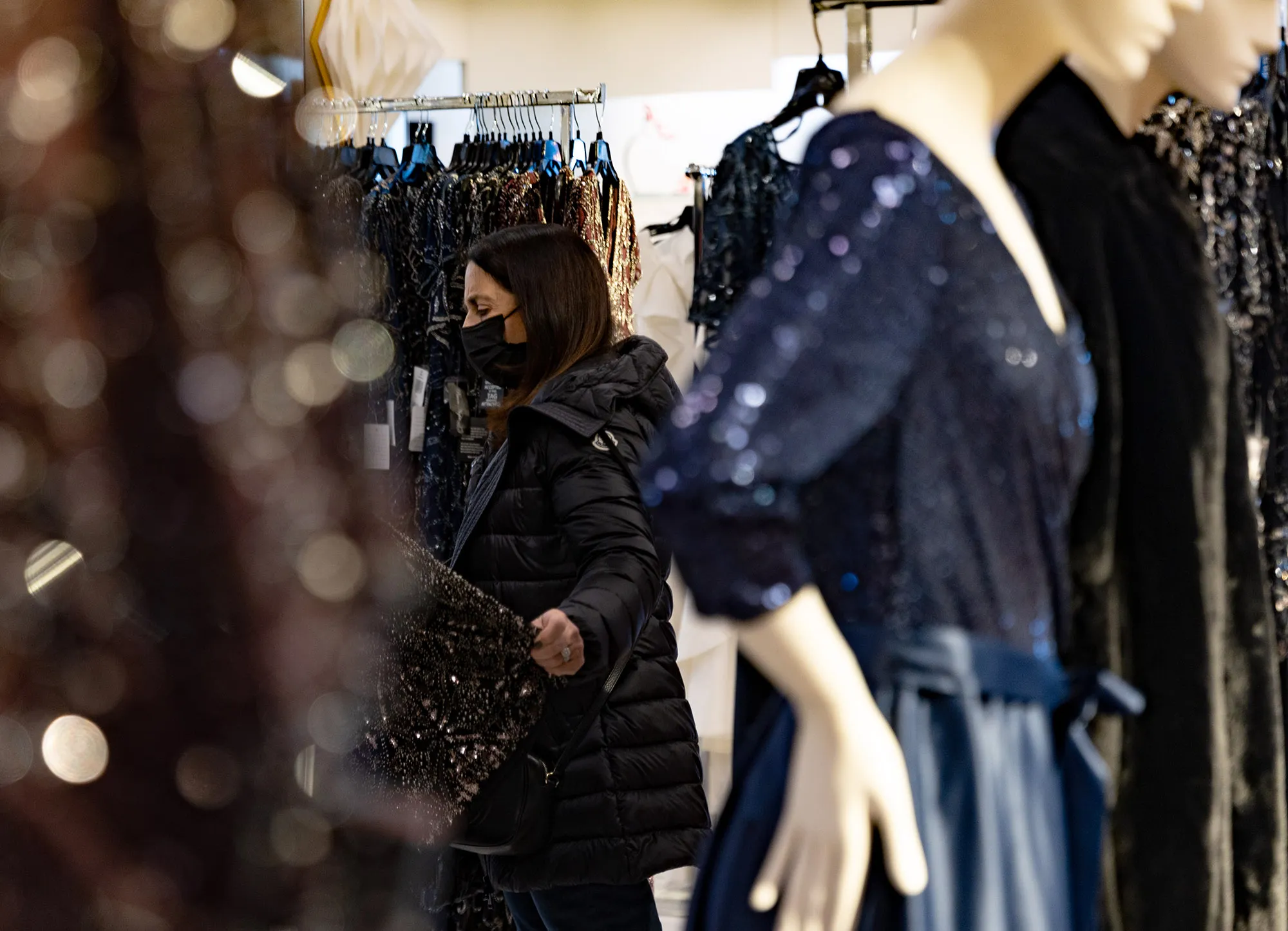 A shopper views gowns for sale at a store inside a mall in King of Prussia, Pennsylvania.