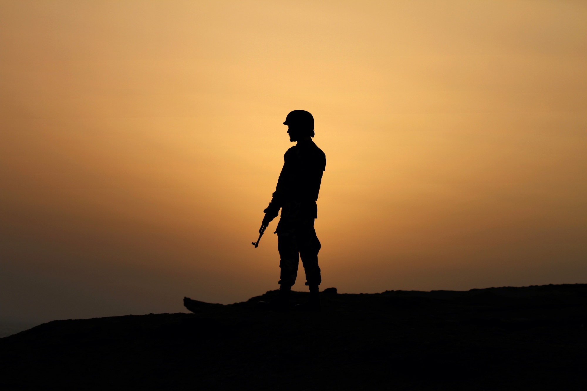 A Pakistan Navy soldier stands guard at a hilltop position near Gwadar.
