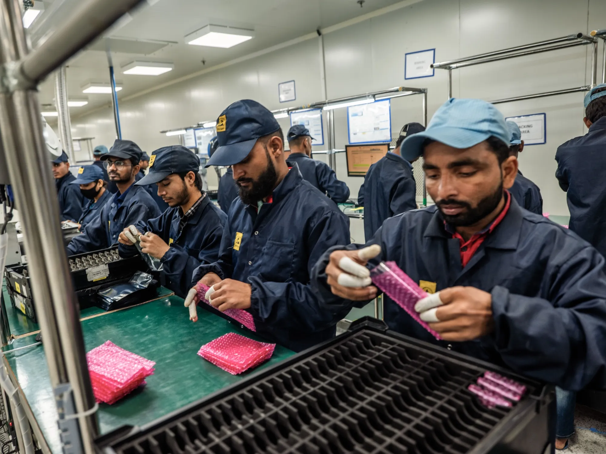 Employees at an arm of Dixon Technologies, in Noida, India. 