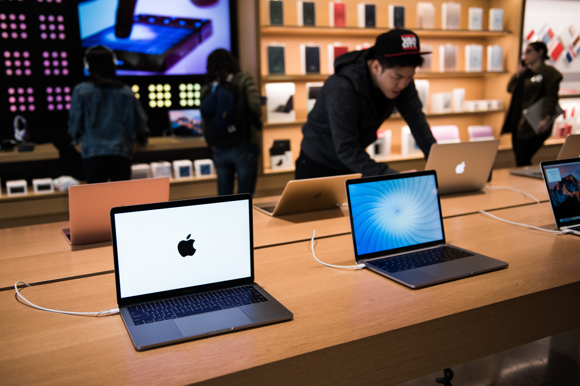 An Apple Store with People Waiting To Purchase Apple Macbooks, IPads and  IPhones Editorial Image - Image of designs, ecosystem: 168250490