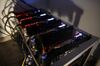 Cryptocurrency mining machines sit in operating racks at the home of Dmitry Gutov.