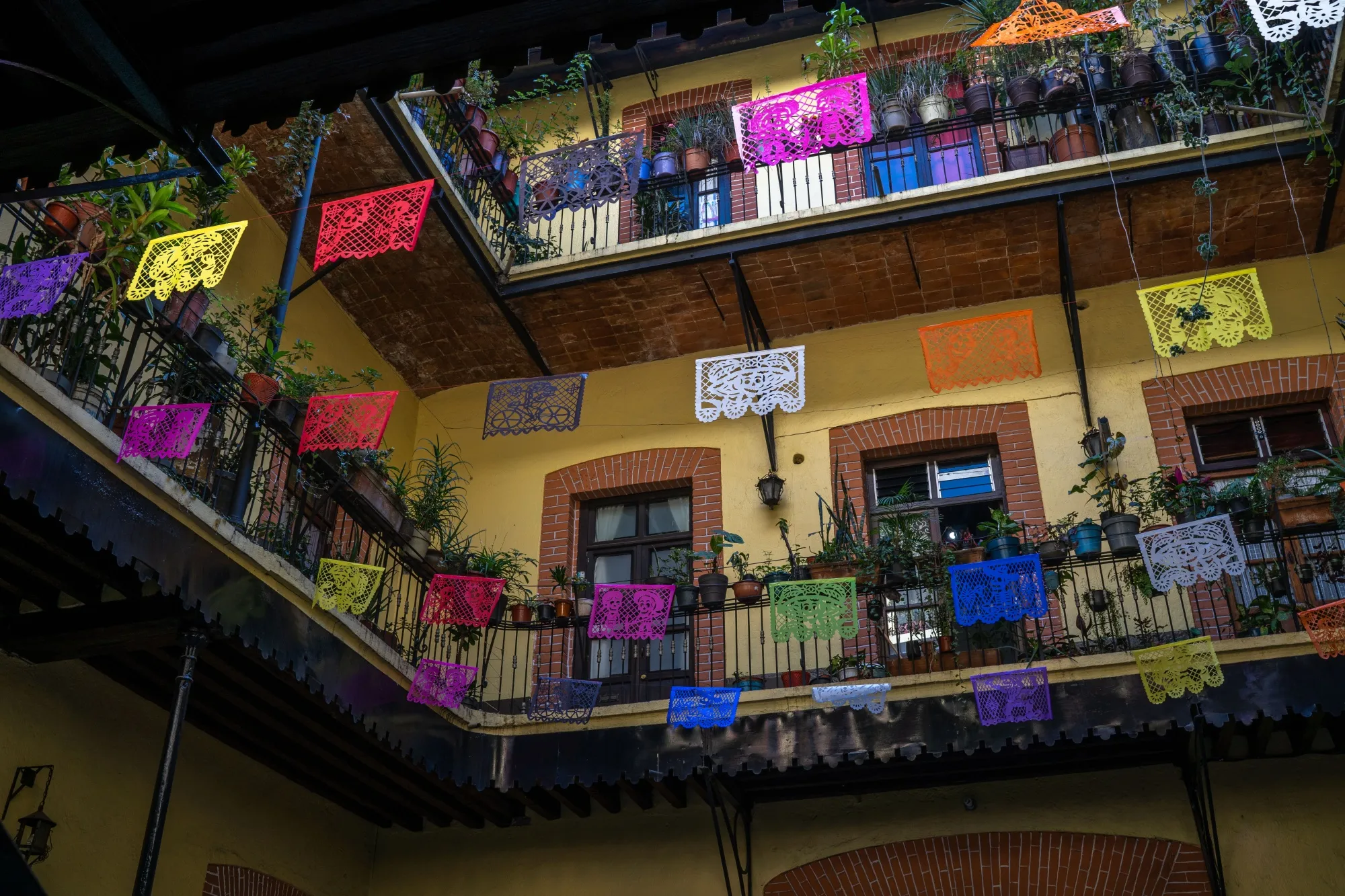 The courtyard of a recently restored Mexico City vecindad,&nbsp;decorated for the annual Day of the Dead celebrations.