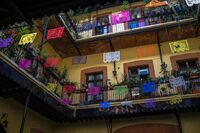 The courtyard of a recently restored Mexico City vecindad, decorated for the annual Day of the Dead celebrations.