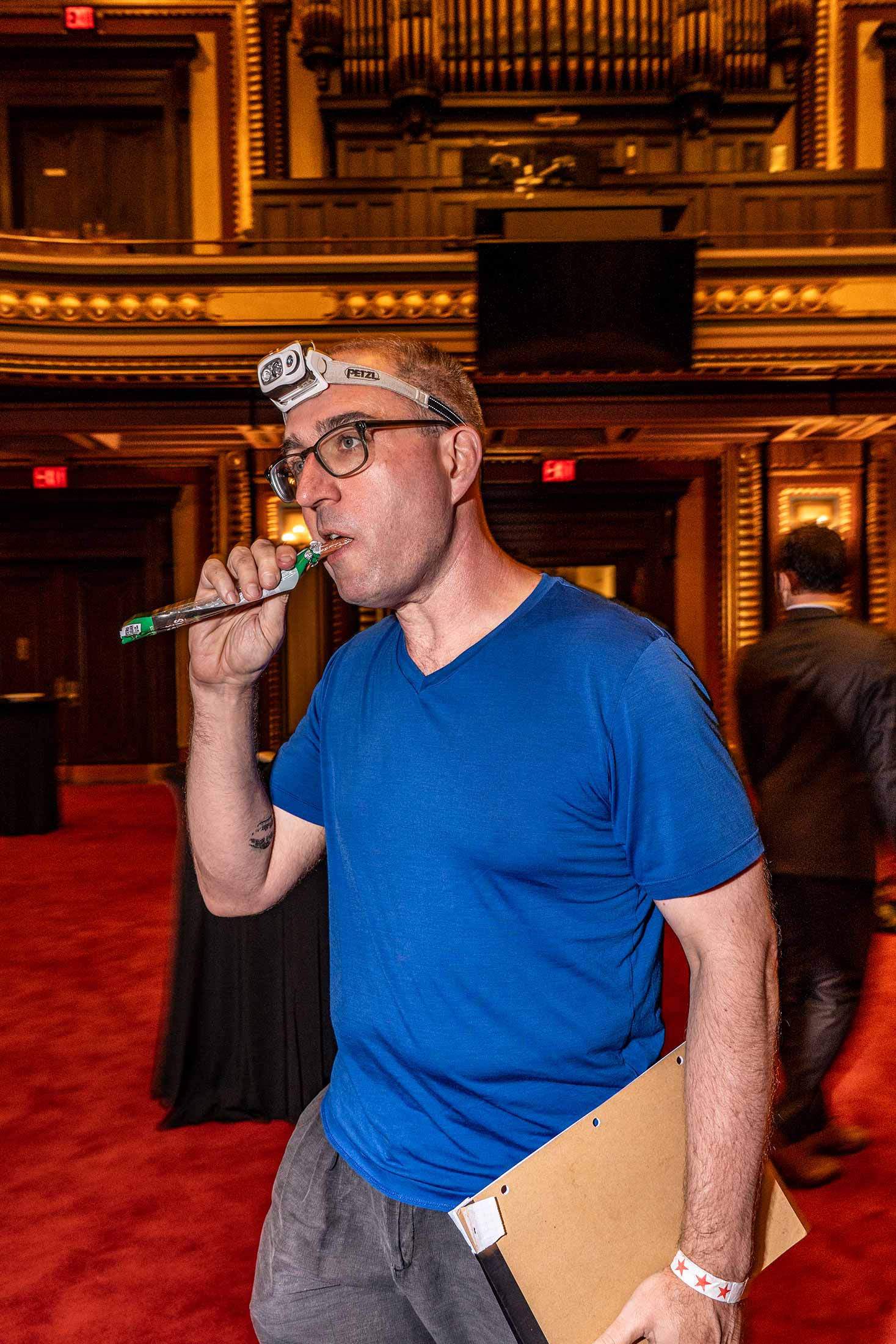 A contestant from team Regenwolk 3000 grabs a snack at the Masonic Hall in Manhattan’s Flatiron District.