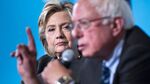 Democratic presidential nominee Hillary Clinton listens as Senator Bernie Sanders speaks on Sept. 28, 2016, in Durham, New Hampshire.
