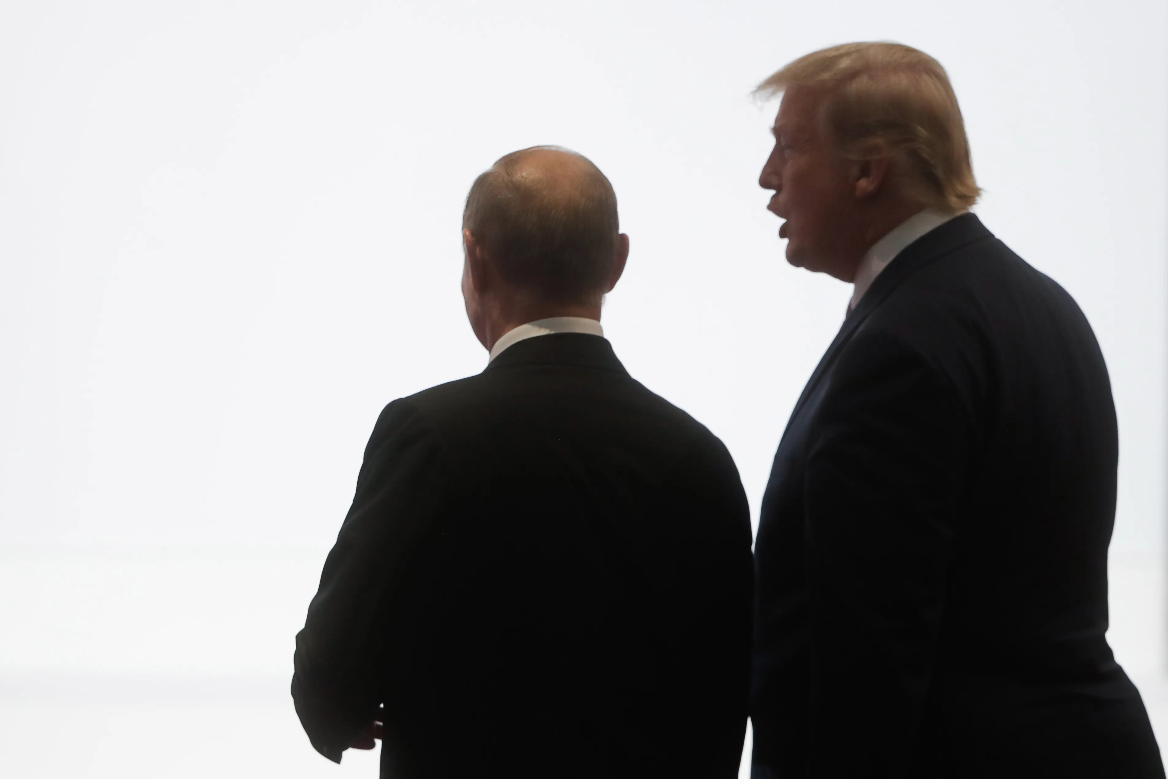 Vladimir Putin, left, and Donald Trump attend the 2019 G20 summit.