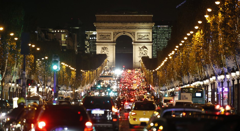 Evening traffic on Paris's Champs-Élysées.