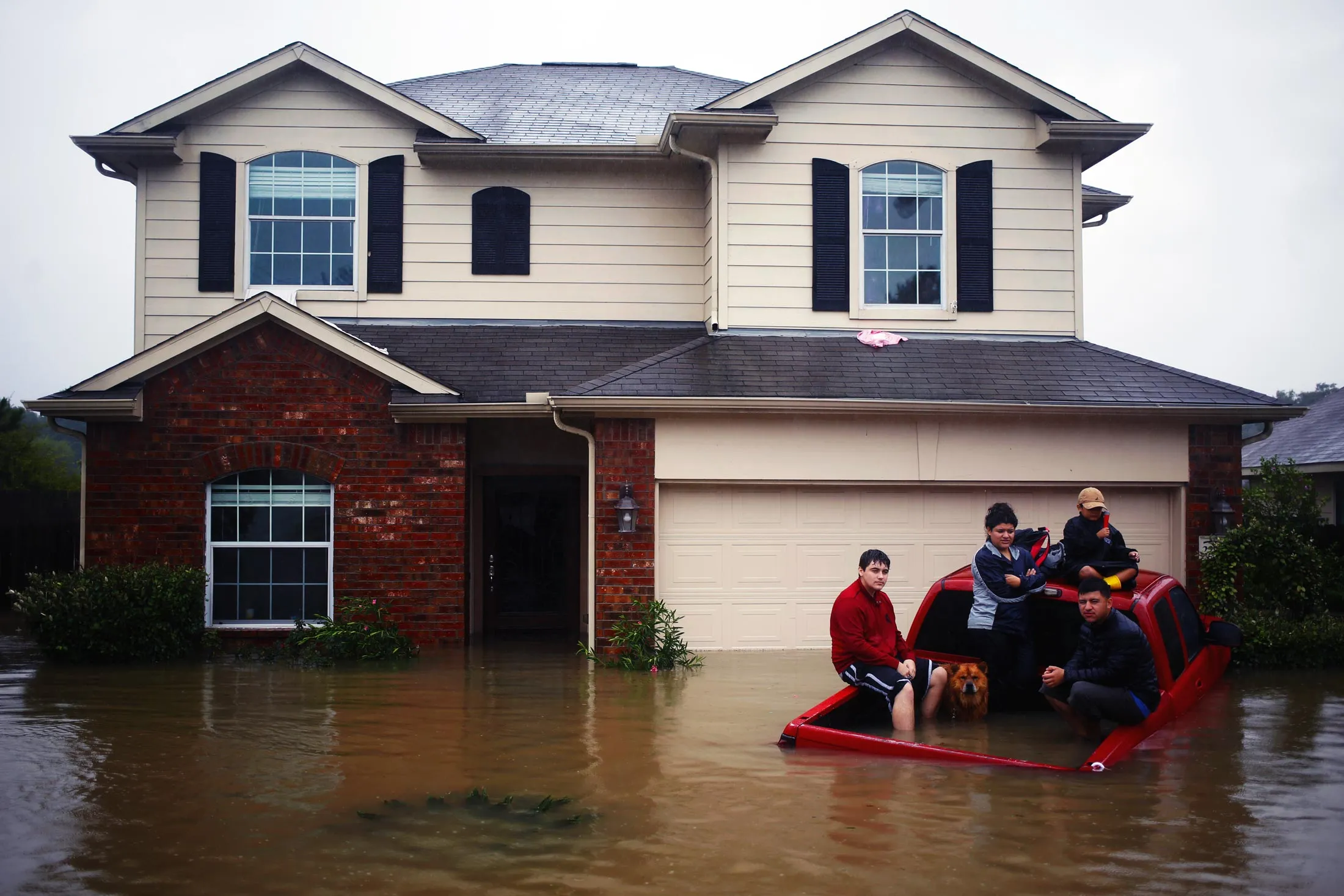 Residents of Spring, Texas wait to be rescued from rising floodwaters following Hurricane Harvey on Aug. 28, 2017.