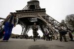French soldiers patrol the area at the foot of the Eiffel Tower in Paris on Nov. 14,