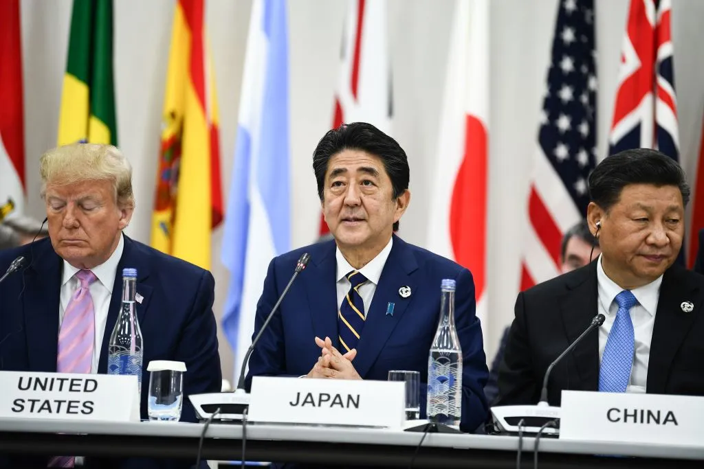 U.S. President Donald Trump, Japan's Prime Minister Shinzo Abe and China's President Xi Jinping attend a meeting at the G20 Summit in Osaka