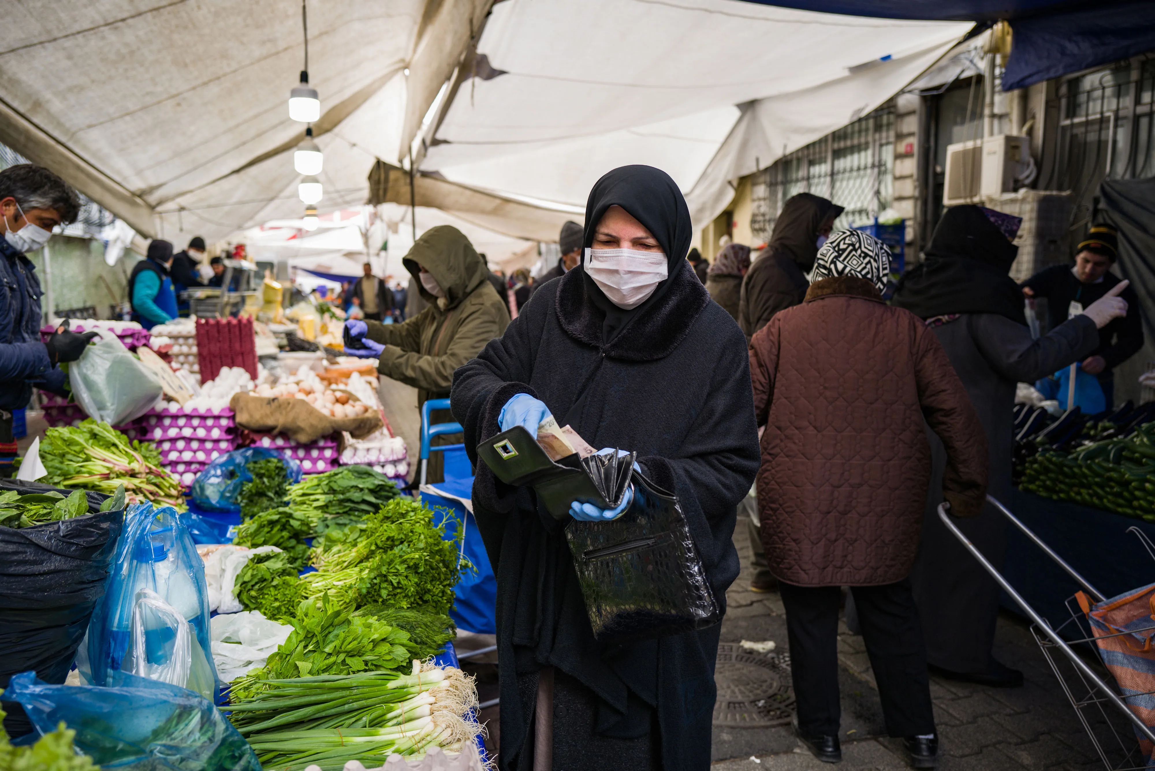 A resident shops at the Fatih outdoor food market in Istanbul.