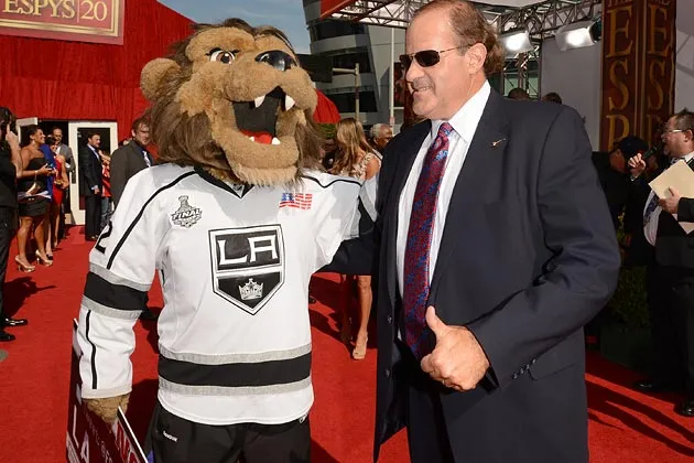 Sportscaster Chris Berman (R) and Bailey, the Los Angeles Kings Mascot, arrive at the 2012 ESPY Awards at Nokia Theatre L.A. Live