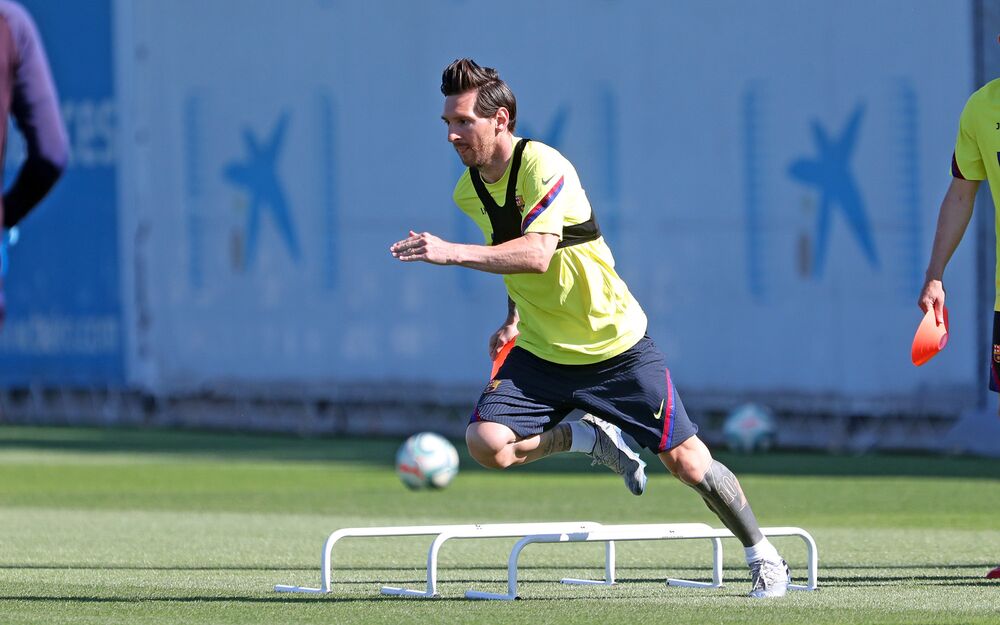 In this handout provided by FC Barcelona Lionel Messi runs during a training session at Ciutat Esportiva Joan Gamper on May 20 2020