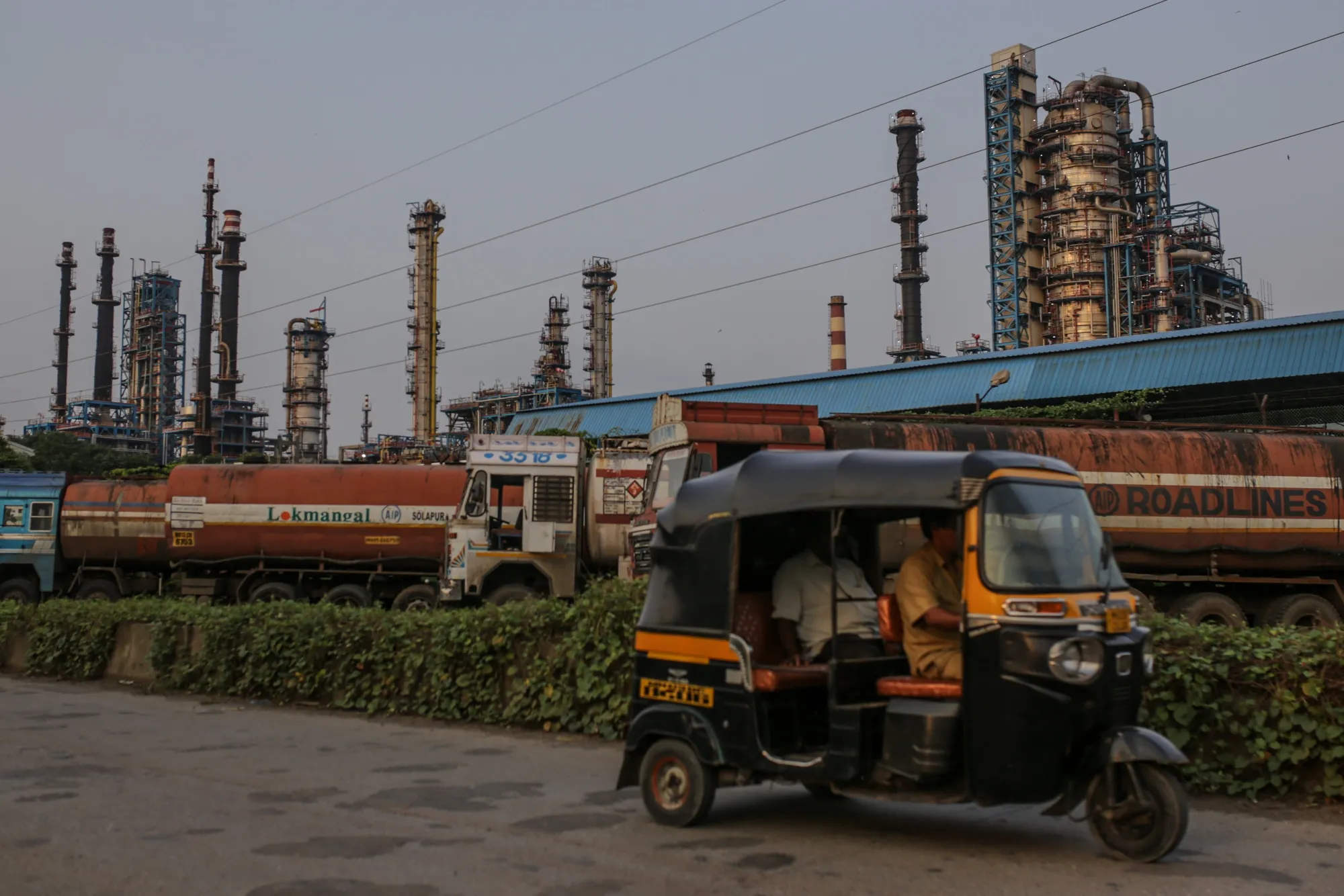 Oil tanker trucks outside an oil refinery operated by Hindustan Petroleum Corp., in Mumbai.