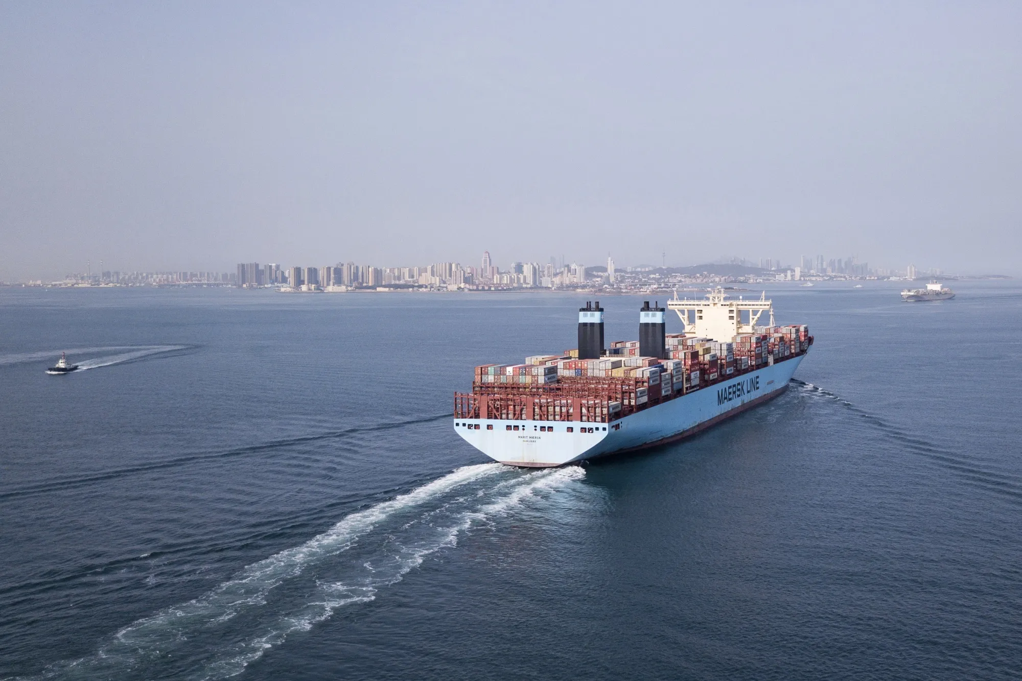 A cargo ship sets sail from the Qingdao Qianwan Container Terminal in Qingdao, China.