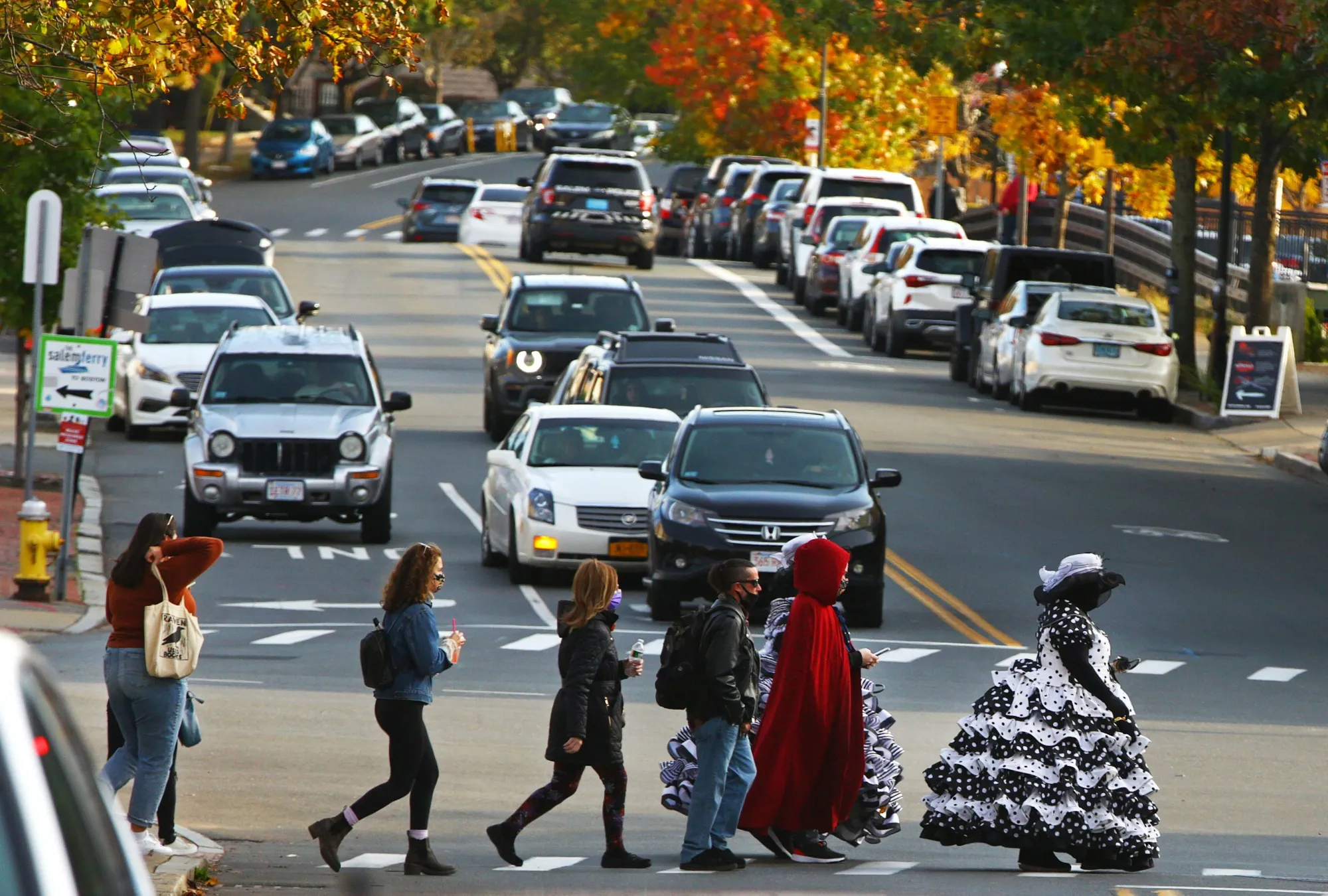 Trick-or-treaters cross&nbsp;a street in Salem, Massachusetts, on Halloween 2020.