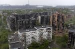 An aerial view of damaged residential buildings and the Azovstal steel plant in the background in the port city of Mariupol on May 18.