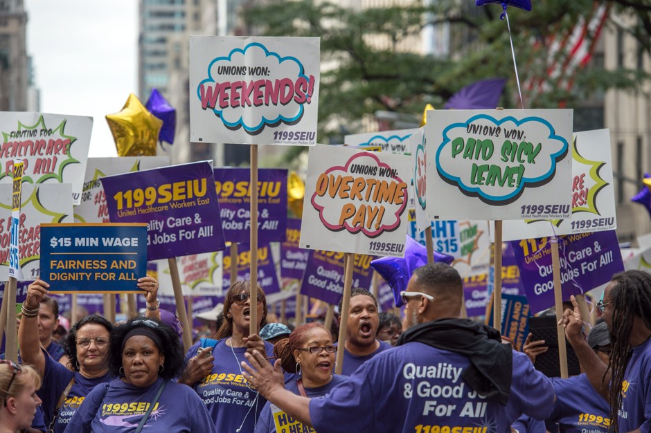 Members of 1199 Service Employees International Union march up Fifth Avenue in the annual Labor Day Parade in New York.