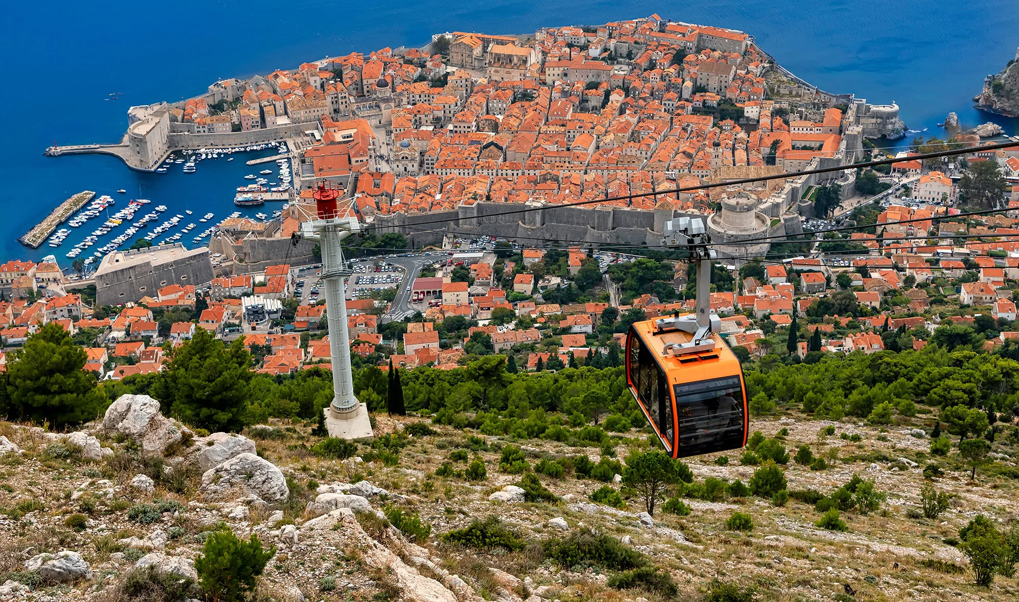 DUBROVNIK, CROATIA - OCTOBER 21: (EDITORS NOTE: Image has been digitally enhanced.) The cable (Zicara Dubrovnik) car operates over the old town at Utvrda Imperijal (Fort Imperial) on October 21, 2018 in Dubrovnik, Croatia. Dubrovnik is one of the oldest towns at the Adriatic Sea, and it is a popular destination of tourists and cruisers.. (Photo by Laszlo Szirtesi/Getty Images)