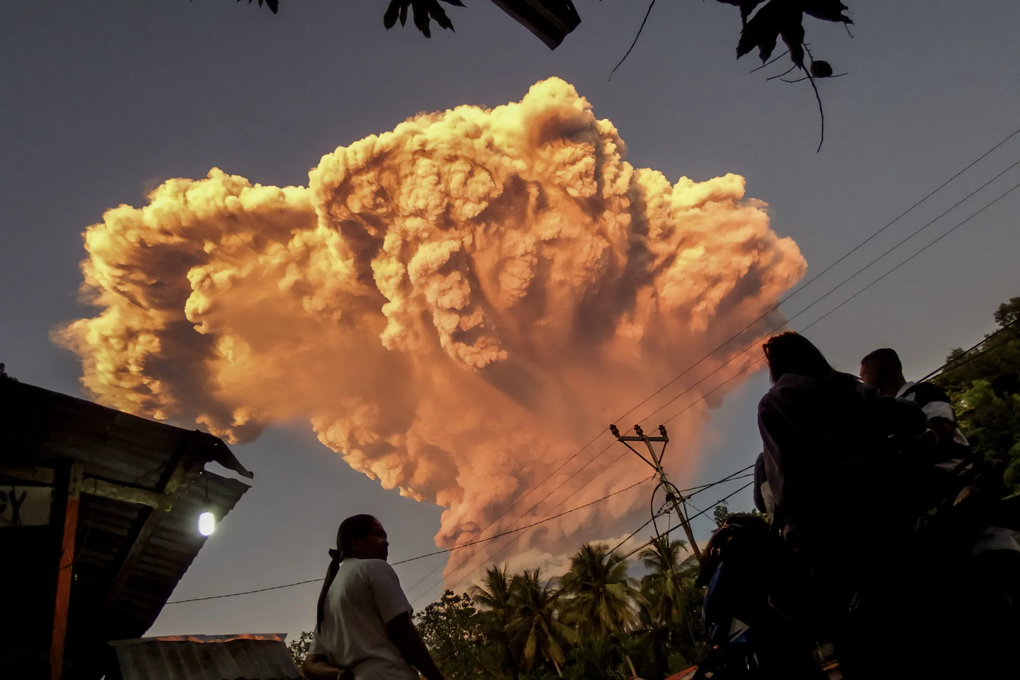 Villagers watch the eruption of Mount Lewotobi Laki-Laki, seen from East Nusa Tenggara, on June 17.