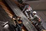 Enpal trainees install solar panels at a training facility in Blankenfelde-Mahlow, Germany. Photographer: Odd Andersen/AFP/Getty Images