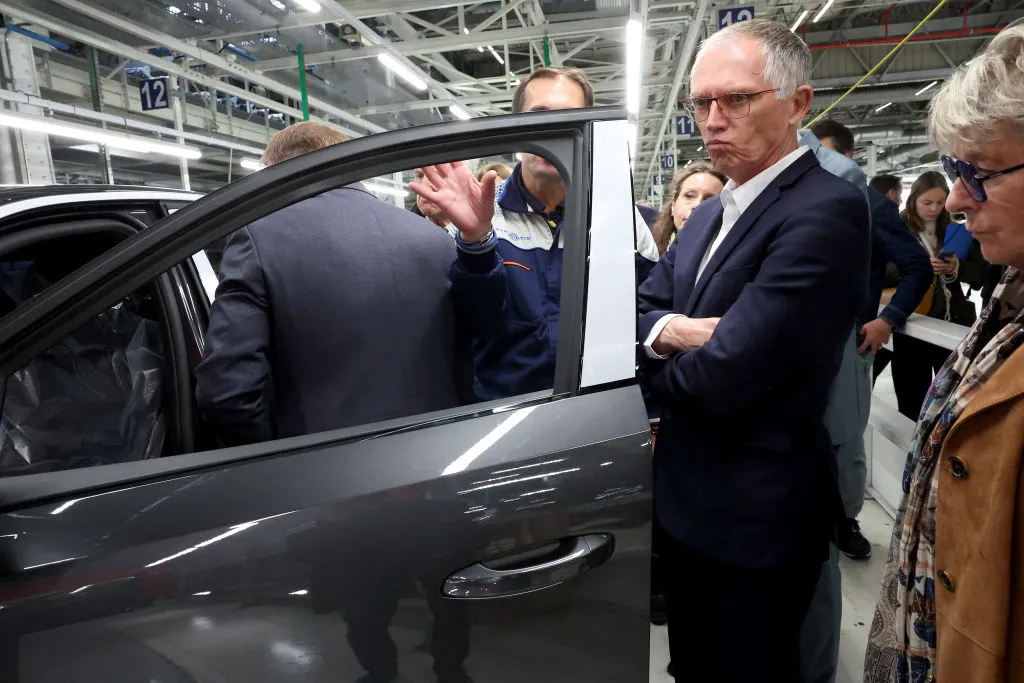 Stellantis CEO Carlos Tavares visits the production line of the new electified Peugeot in Sochaux, France.